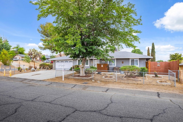 40103 E 169th St, Palmdale, CA 93591 - ranch-style house with driveway, a fenced front yard, and a garage