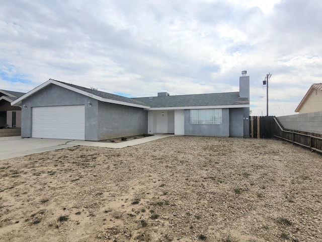 single story home with a garage