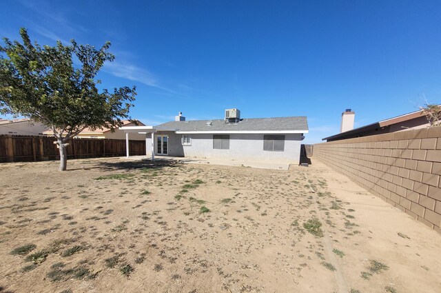 back of property with central air condition unit