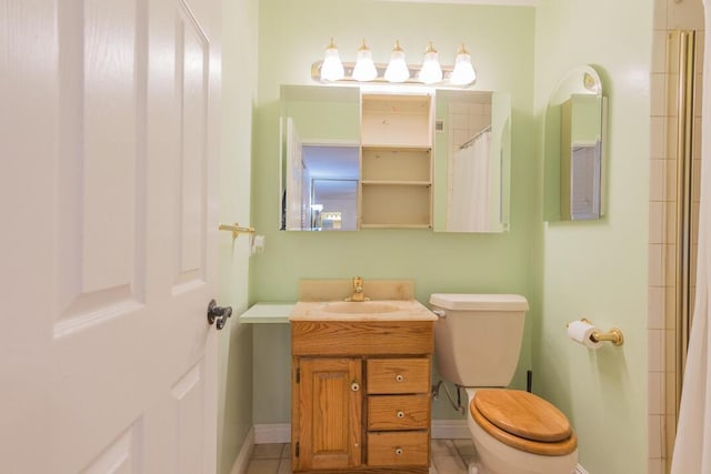 22437 Haynes St, West Hills, CA 91307 - full bathroom with vanity, toilet, baseboards, and tile patterned floors