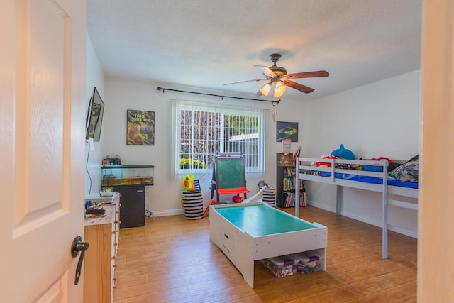 22437 Haynes St, West Hills, CA 91307 - bedroom with light wood-type flooring, baseboards, and ceiling fan