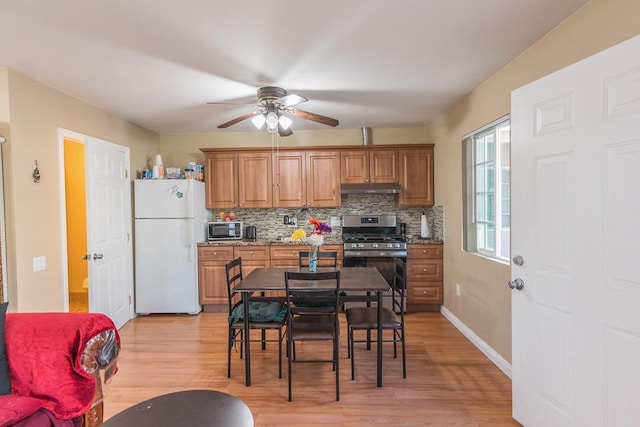 22437 Haynes St, West Hills, CA 91307 - kitchen featuring freestanding refrigerator, gas stove, ceiling fan, and light wood-style flooring