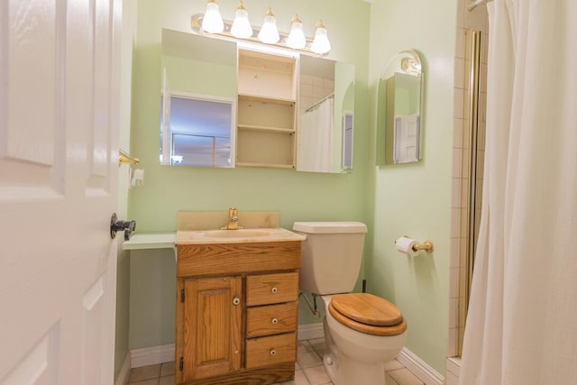 22437 Haynes St, West Hills, CA 91307 - bathroom with toilet, baseboards, tile patterned flooring, tiled shower, and vanity