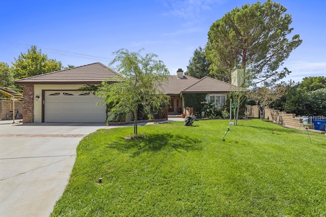 ranch-style house with a garage and a front lawn