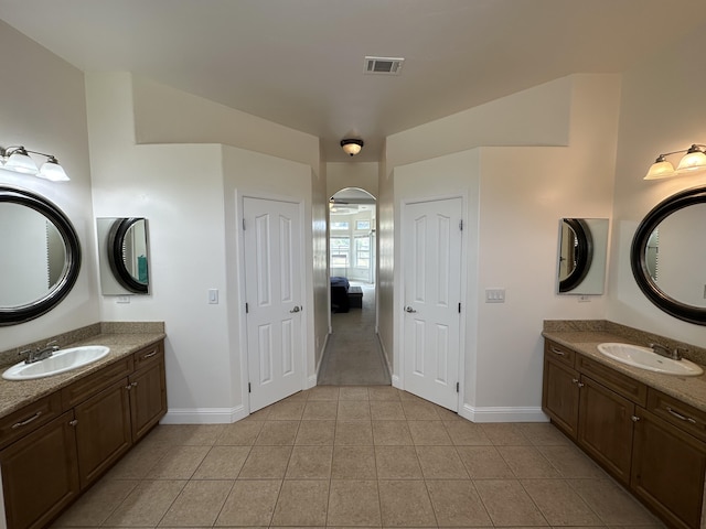24500 Jacaranda Dr, Tehachapi, CA 93561 - bathroom with baseboards, tile patterned floors, and two vanities