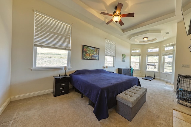 24500 Jacaranda Dr, Tehachapi, CA 93561 - bedroom featuring light colored carpet, baseboards, a tray ceiling, and a ceiling fan