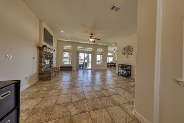 24500 Jacaranda Dr, Tehachapi, CA 93561 - unfurnished living room with ceiling fan, baseboards, a fireplace, and recessed lighting