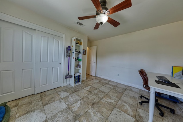 24500 Jacaranda Dr, Tehachapi, CA 93561 - office with stone finish floors, baseboards, and a ceiling fan