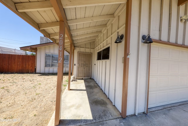 20412 El Porto Ct, Tehachapi, CA 93561 - property entrance featuring board and batten siding and a garage