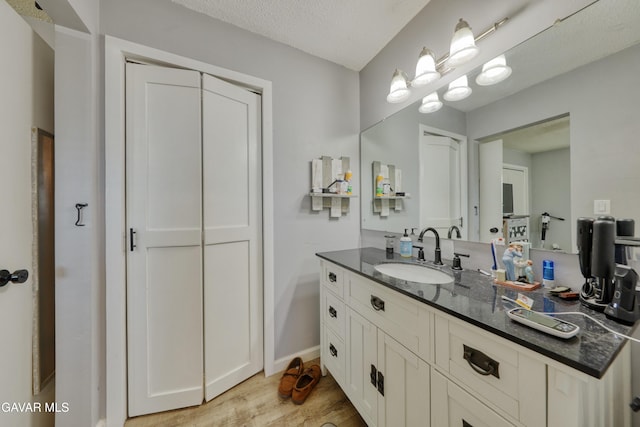 20412 El Porto Ct, Tehachapi, CA 93561 - bathroom with vanity and wood finished floors