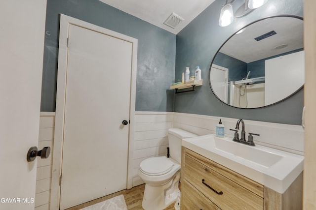 20412 El Porto Ct, Tehachapi, CA 93561 - full bath with vanity, wainscoting, and wood finished floors