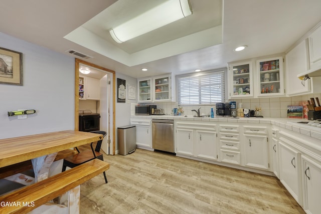 20412 El Porto Ct, Tehachapi, CA 93561 - kitchen with tile counters, tasteful backsplash, white cabinetry, and recessed lighting