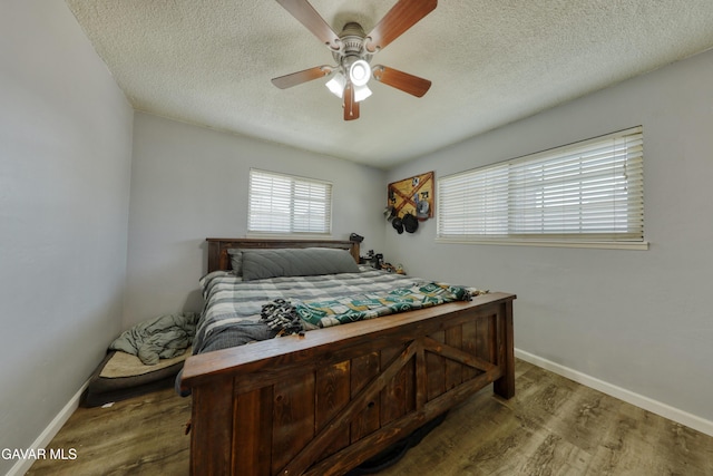 20412 El Porto Ct, Tehachapi, CA 93561 - bedroom featuring wood finished floors, a textured ceiling, and ceiling fan