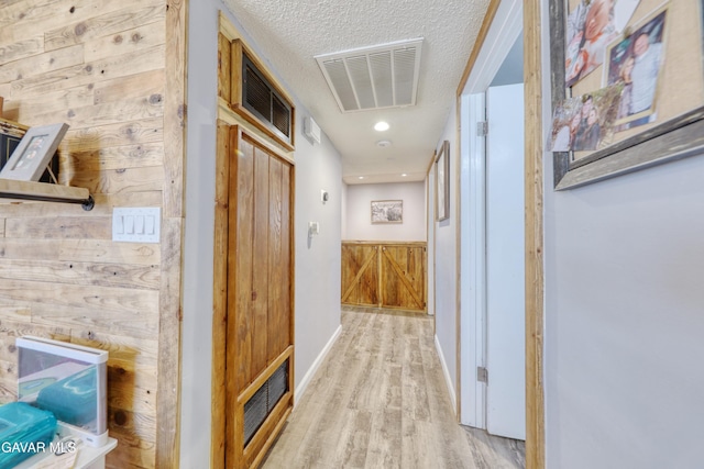 20412 El Porto Ct, Tehachapi, CA 93561 - hallway featuring wood finished floors, a textured ceiling, and recessed lighting