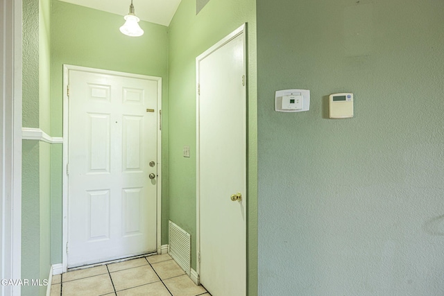 6019 Diamond St, Palmdale, CA 93552 - doorway to outside with light tile patterned flooring and baseboards