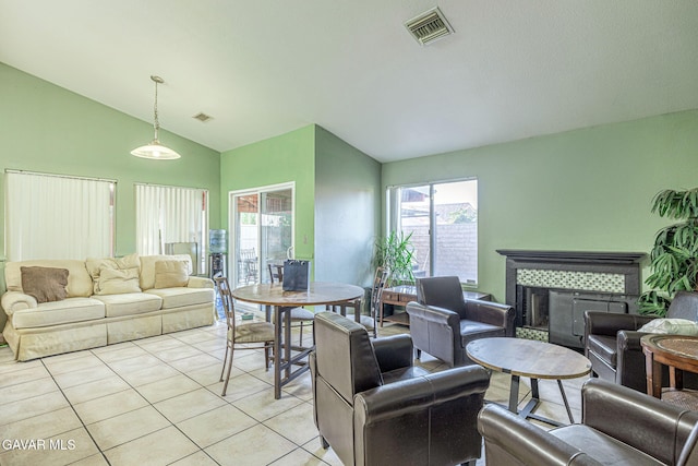 6019 Diamond St, Palmdale, CA 93552 - living area with vaulted ceiling, light tile patterned floors, and a fireplace