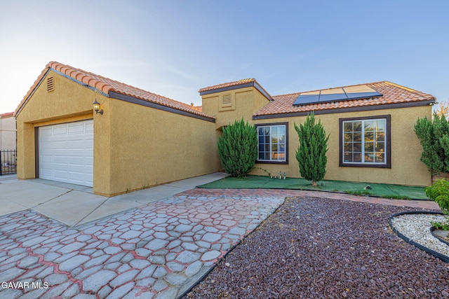6019 Diamond St, Palmdale, CA 93552 - view of front of property featuring stucco siding, solar panels, and a tile roof