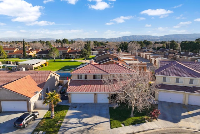 aerial view featuring a mountain view and a residential view