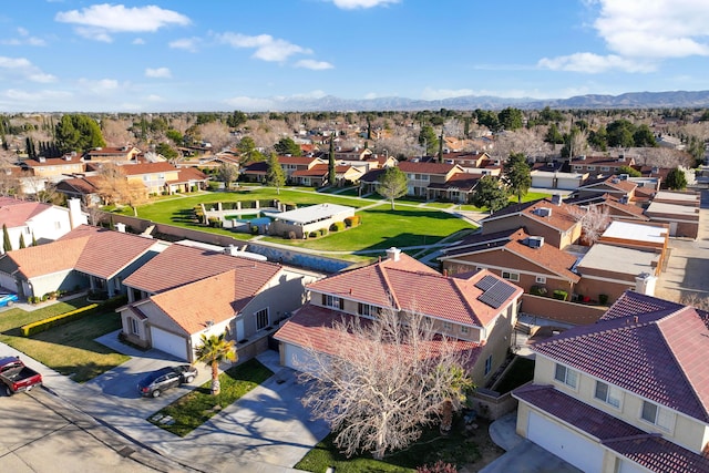 drone / aerial view featuring a mountain view and a residential view