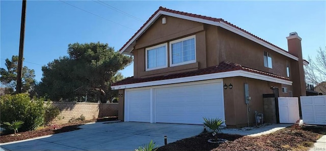 view of side of home with a garage