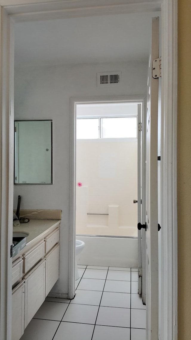 full bathroom featuring tile patterned flooring, vanity, toilet, and shower / bathing tub combination