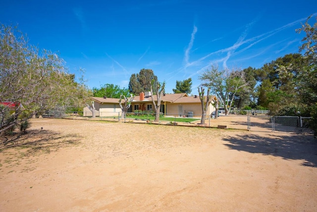view of front of home featuring stucco siding and fence