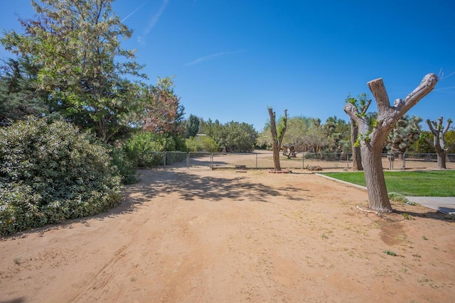 view of street featuring a gate and driveway