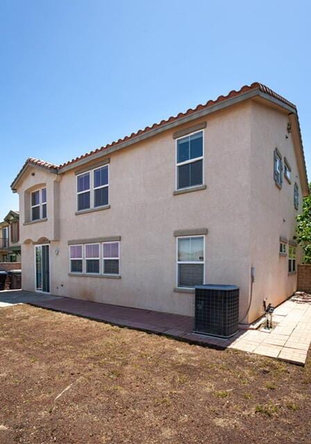 2447 Brompton Ct, Palmdale, CA 93551 - back of house with cooling unit, a patio, and stucco siding