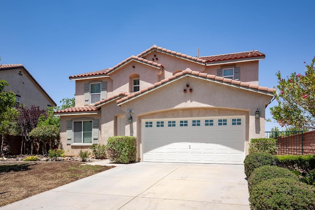 2447 Brompton Ct, Palmdale, CA 93551 - mediterranean / spanish-style house featuring driveway, a tile roof, a garage, and stucco siding