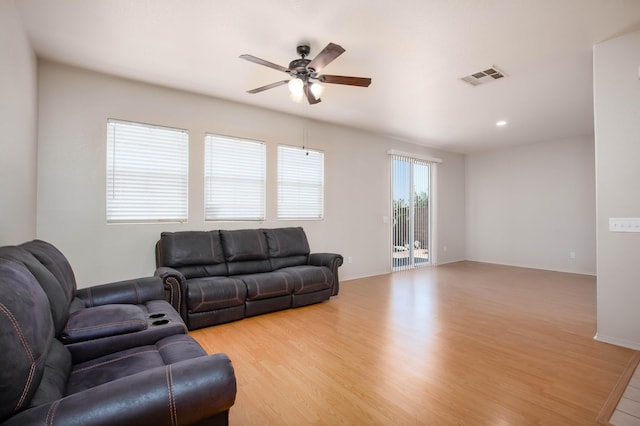 2447 Brompton Ct, Palmdale, CA 93551 - living area with a ceiling fan and light wood-style flooring