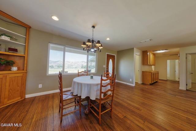 19426 Cavalier Ct, Tehachapi, CA 93561 - dining space with dark wood-style floors, a chandelier, and recessed lighting