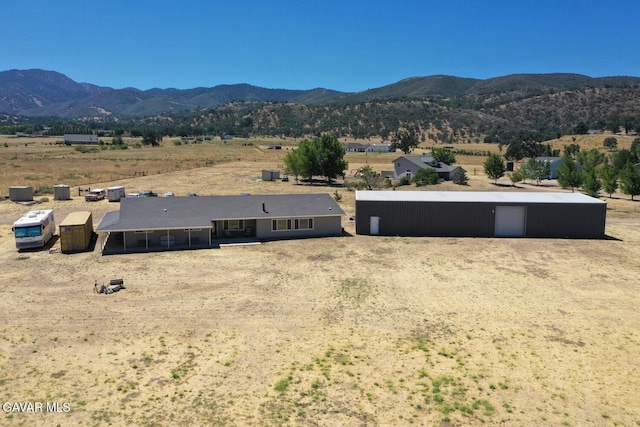 19426 Cavalier Ct, Tehachapi, CA 93561 - view of front facade featuring a mountain view, a view of countryside, and a garage
