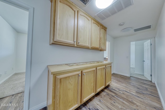 19426 Cavalier Ct, Tehachapi, CA 93561 - kitchen with light brown cabinets, light wood-type flooring, and light countertops