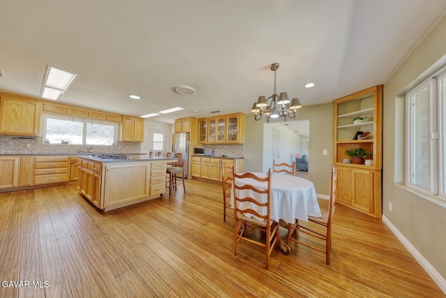19426 Cavalier Ct, Tehachapi, CA 93561 - dining room with a chandelier, light wood-style floors, and recessed lighting