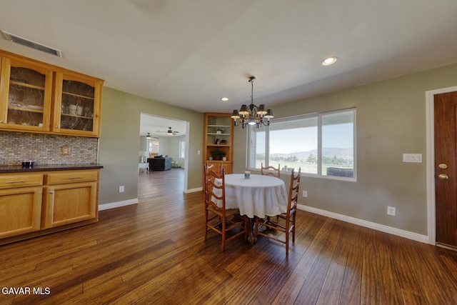 19426 Cavalier Ct, Tehachapi, CA 93561 - dining area featuring a chandelier, dark wood-style floors, and recessed lighting