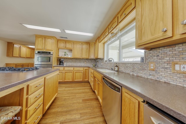 19426 Cavalier Ct, Tehachapi, CA 93561 - kitchen featuring appliances with stainless steel finishes, light brown cabinets, light wood-style floors, backsplash, and open shelves
