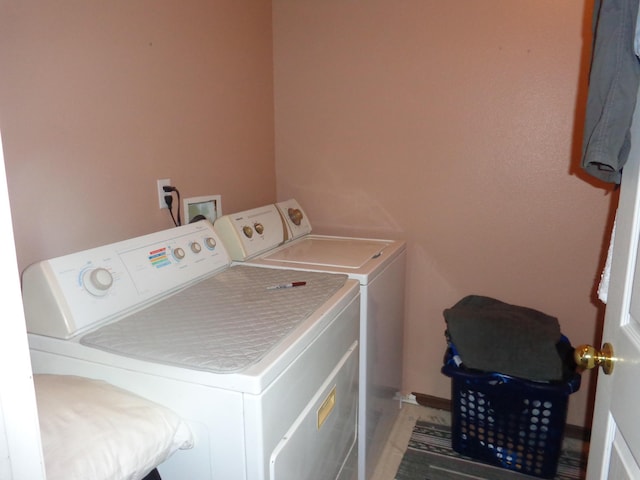 washroom with washer and dryer