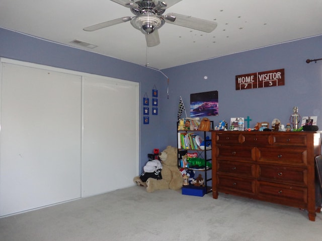 carpeted bedroom featuring ceiling fan