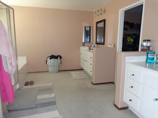 bathroom featuring vanity and a bathtub