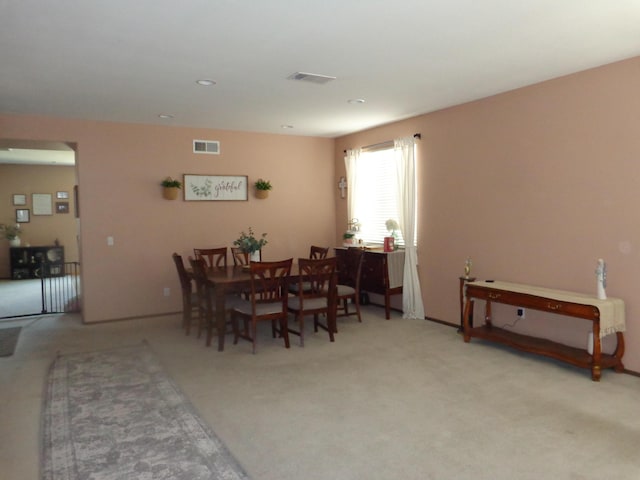 dining area with light carpet