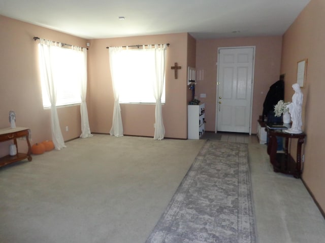 view of carpeted foyer