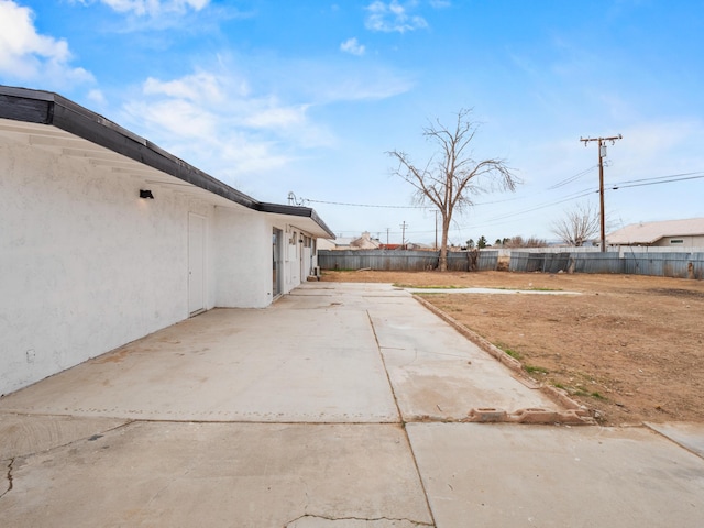 view of yard featuring a patio and fence