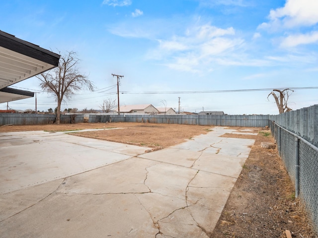 view of yard with a patio area and a fenced backyard