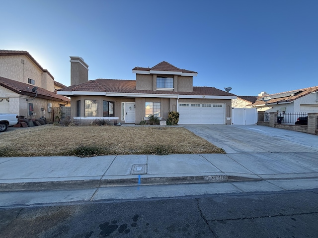 view of front property featuring a front yard and a garage