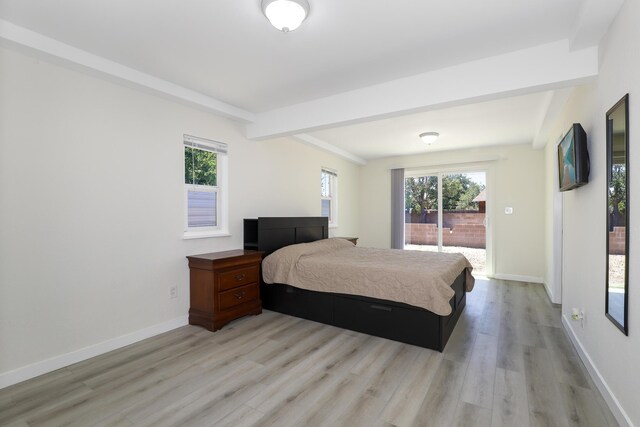 300 W W Ave J9, Lancaster, CA 93534 - bedroom featuring access to outside, light wood finished floors, and beam ceiling