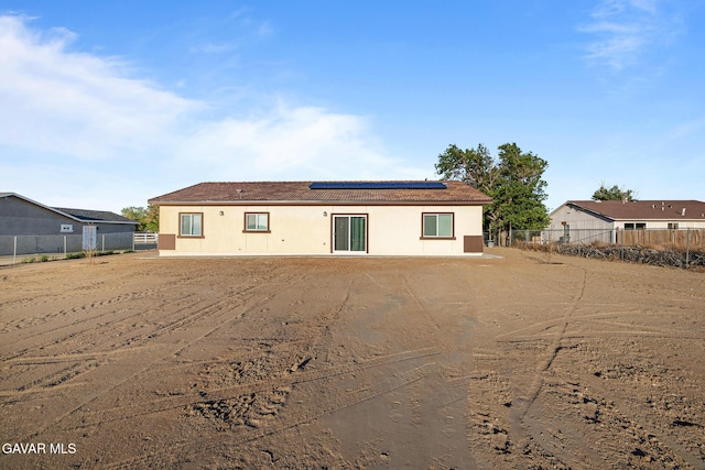 40719 E 171st St, Lake Los Angeles, CA 93535 - back of property with roof mounted solar panels and stucco siding