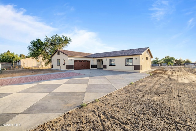 40719 E 171st St, Lake Los Angeles, CA 93535 - ranch-style home featuring driveway, a garage, stucco siding, and a tile roof