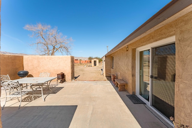 view of patio / terrace with outdoor dining space and fence