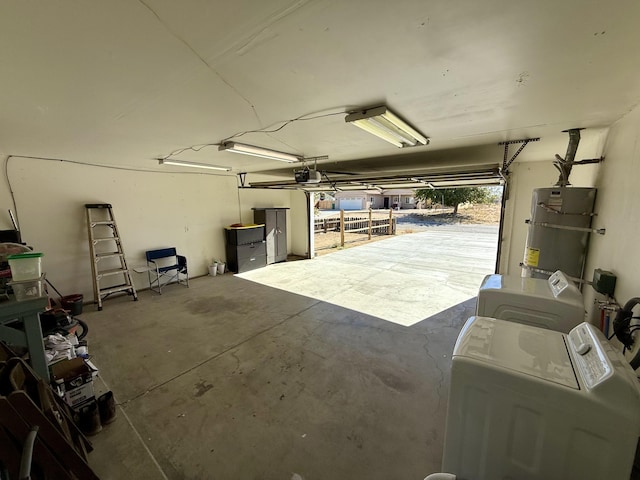 garage with independent washer and dryer, secured water heater, and a garage door opener