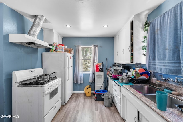 1411 W Ivesbrook St, Lancaster, CA 93534 - kitchen featuring white appliances, white cabinetry, light wood-style floors, wall chimney exhaust hood, and recessed lighting